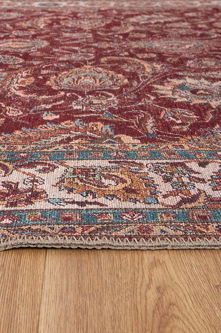 Shiraz Persian Red Area Rug on side in a room