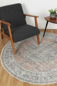 Load image into Gallery viewer, Distressed Vintage Oxus Desert Round Rug under table
